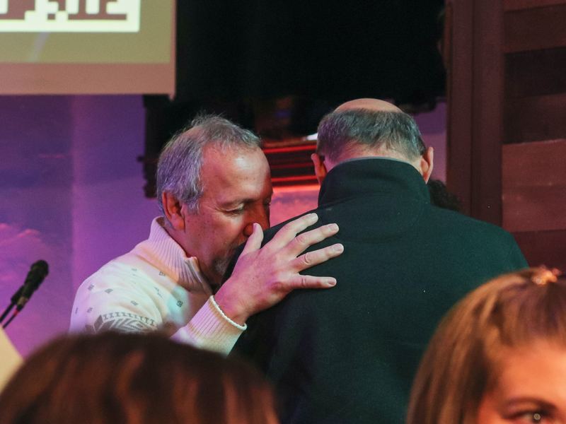 Praying with someone at the front of the church